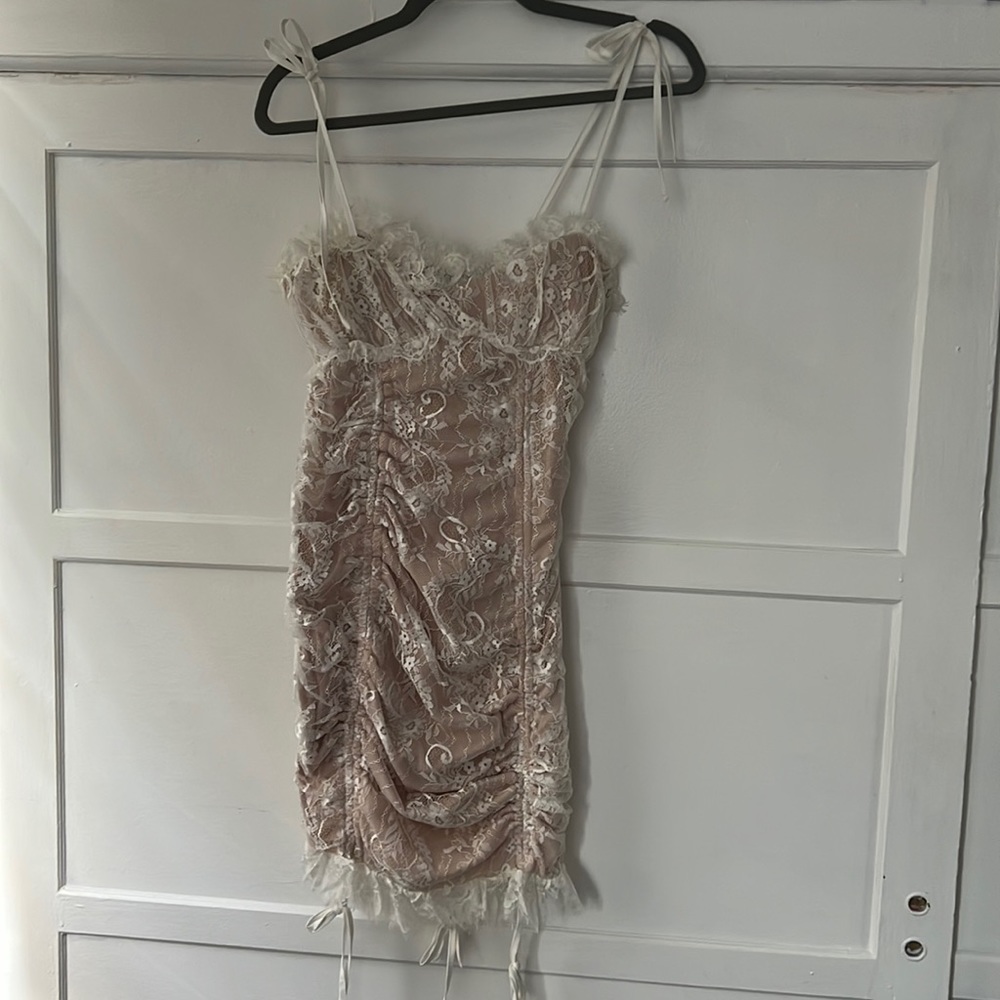 Shareen collections white lace dress with tie detailing. Size: 12. NWT.